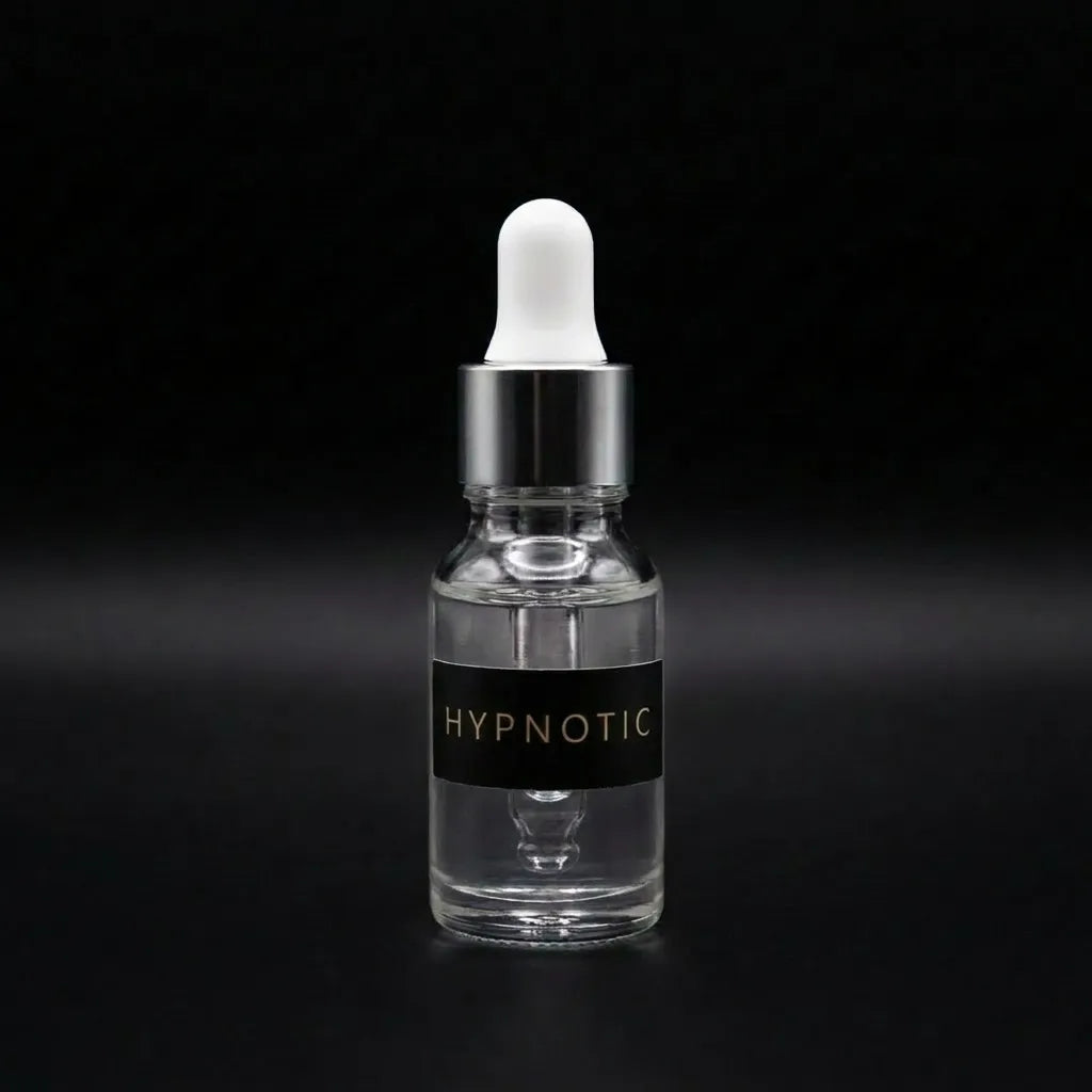 Aramystic Hypnotic 3ml perfume oil in a clear glass dropper bottle on a black background