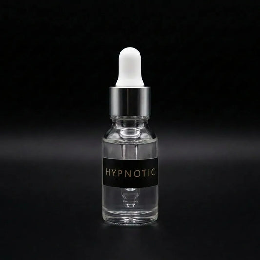 Aramystic Hypnotic 3ml perfume oil in a clear glass dropper bottle on a black background