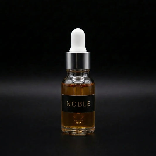 Aramystic Noble 3ml perfume oil in a glass dropper bottle with amber oil on a black background